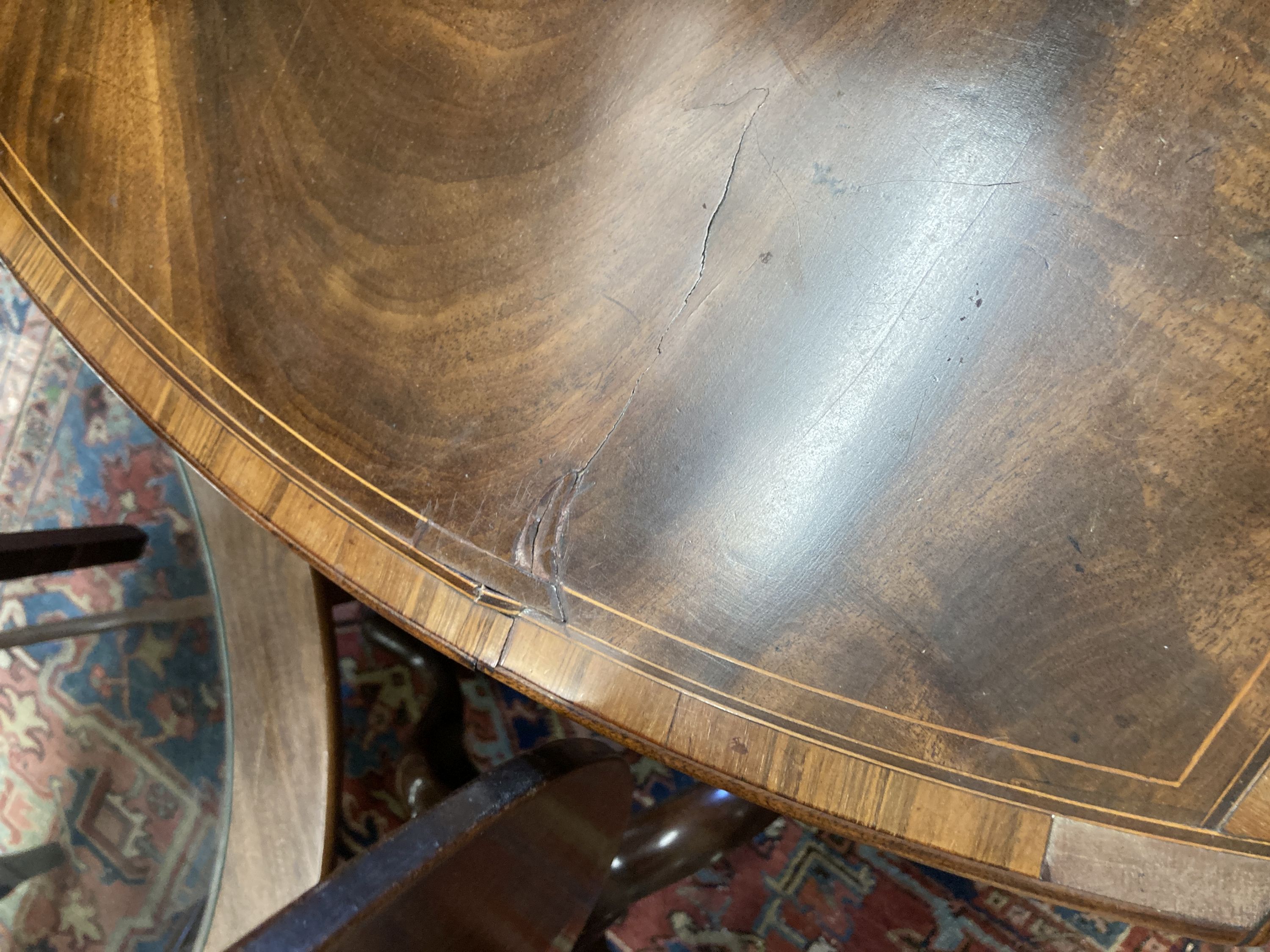 A George III rosewood banded and inlaid mahogany oval Pembroke table, width 79cm depth 49cm, height 68cm